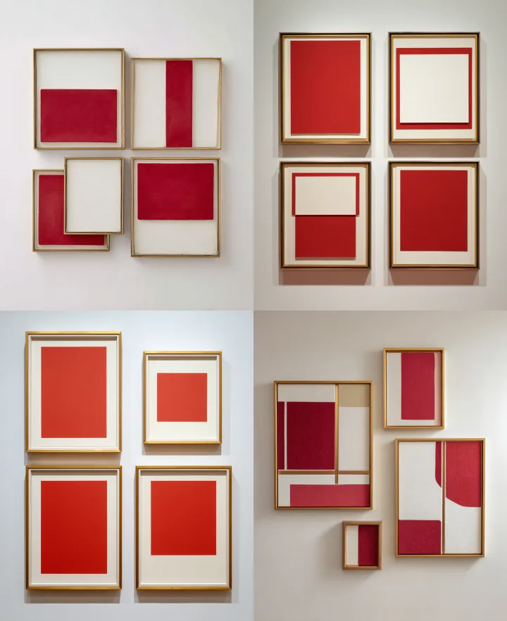 a set of four framed red and cream abstract shapes